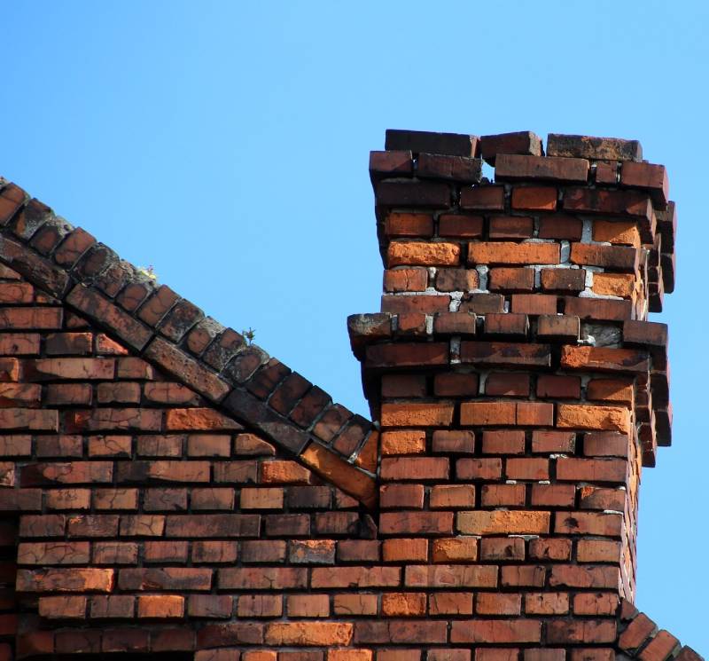 Signs Your Bethesda Home Needs a Chimney Inspection Damaged chimney on an Bethesda home showing cracks and missing mortar